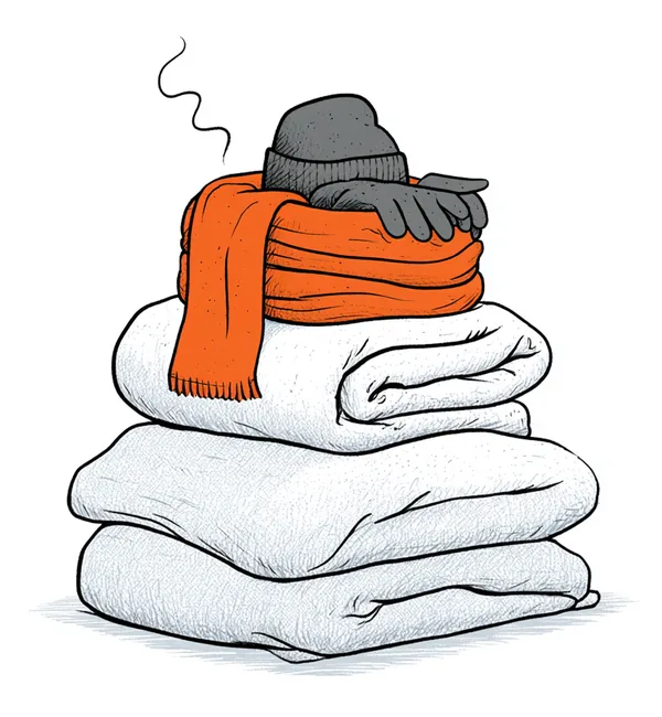 A neat stack of folded winter layers — sweater, scarf, woollen cap and gloves.