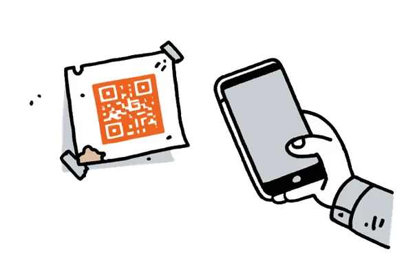 A laminated QR-code card taped to a wall, a phone about to scan it for UPI payment.